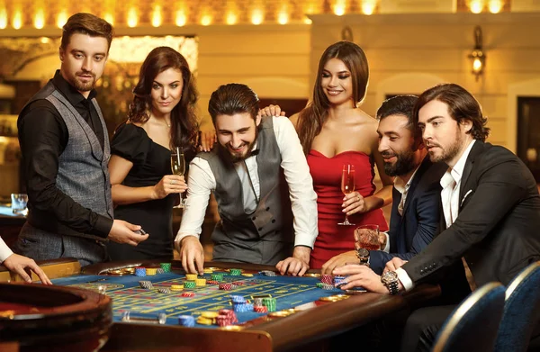 20000+ Free Casino Games 1 depositphotos 274934220 stock photo friends make bets gambiling at